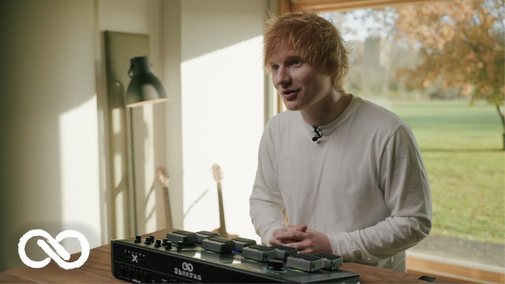 Ed Sheeran showing off a guitar loop pedal.